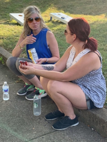 two party-goers chatting